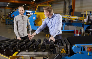 Power Stow employee showing features on the belt loader