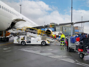 Baggage handling with Power Stow belt loader at IGS Ground Services.