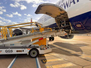 Power Stow Rollertrack Conveyor in use by Gatwick Ground Services loading a British Airways aircraft at London Gatwick Airport.