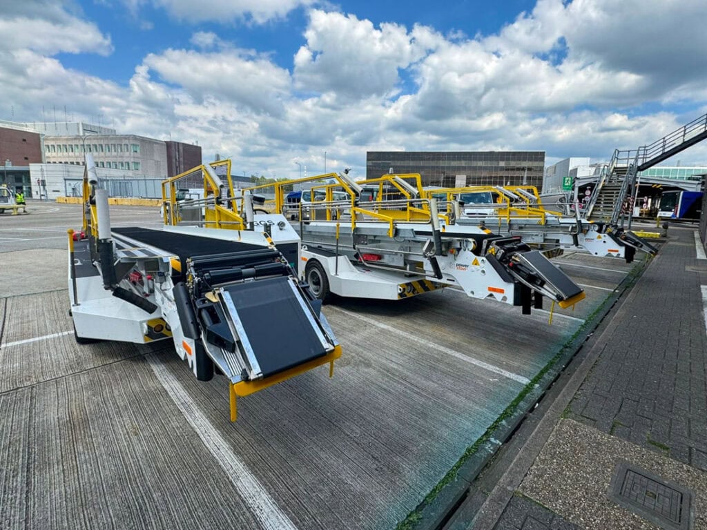 Power Stow Rollertrack Conveyors parked at London Gatwick Airport for use by Gatwick Ground Services supporting ground operations.